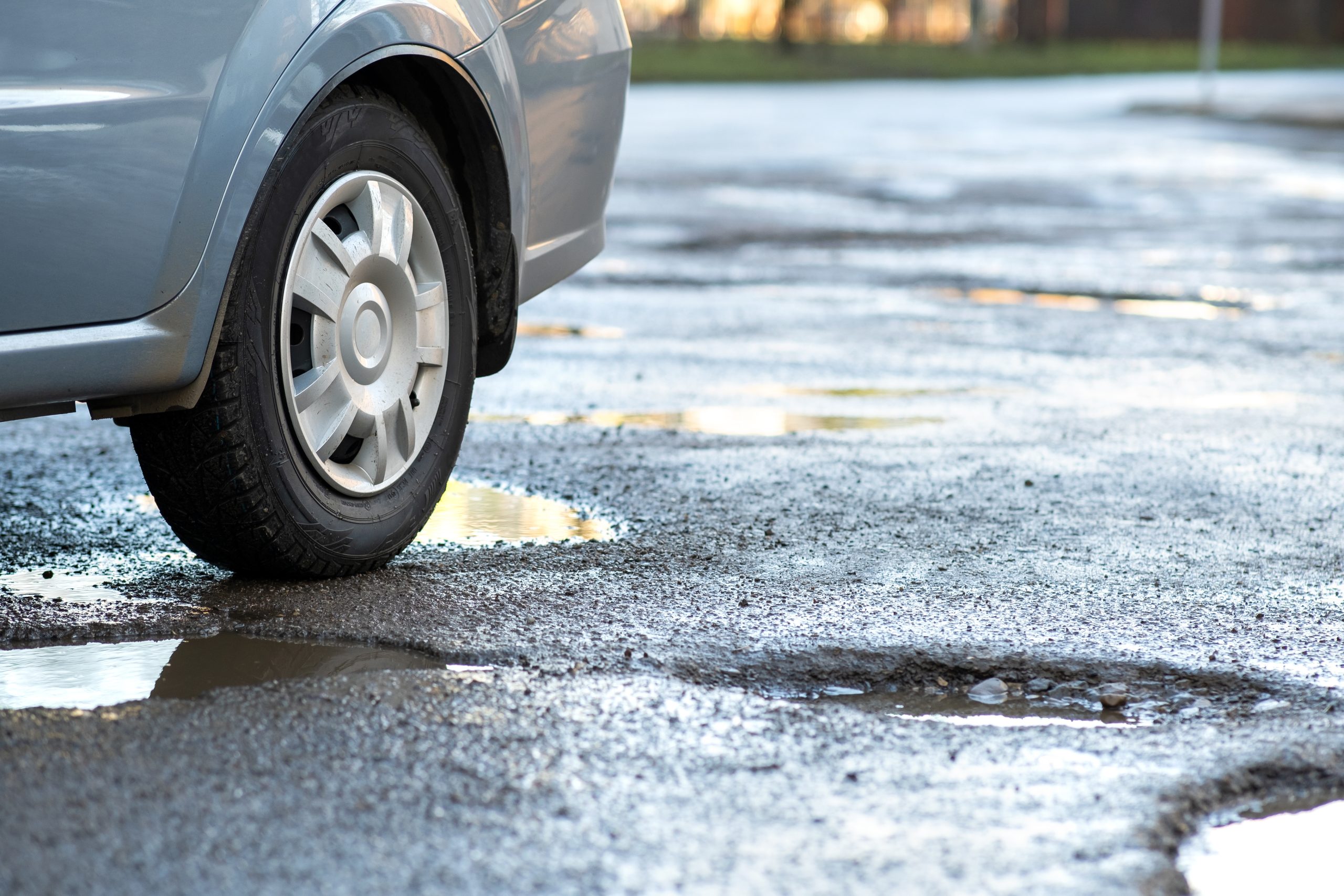 After the Impact: What Potholes Really Do to Steering, Suspension and Alignment
